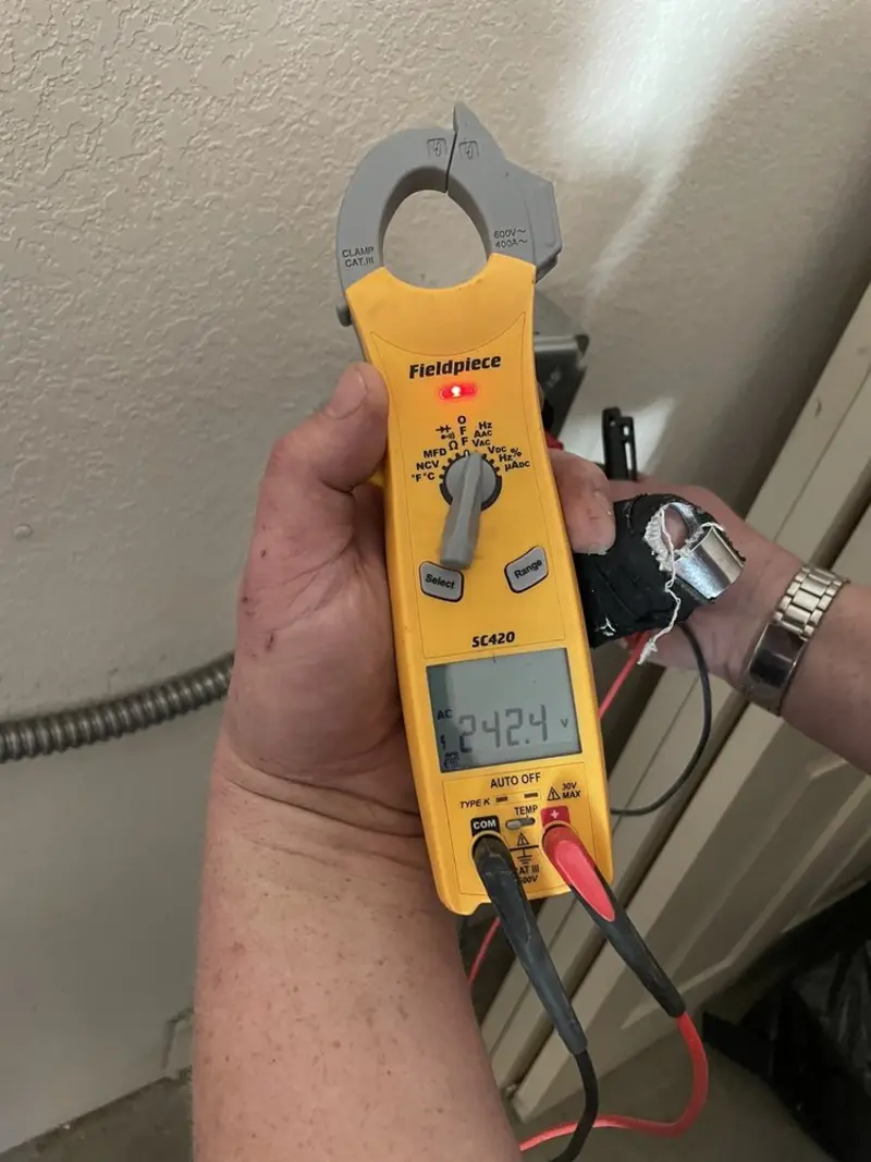 Voltage testing with clamp meter during Electrical Installation Services in Columbia